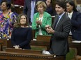 Deputy Prime Minister and Minister of Finance Chrystia Freeland receives applause from Prime Minister Justin Trudeau, right, and other members of the Liberal Party after she presented the federal budget in the House of Commons in Ottawa, Tuesday, April 16, 2024.