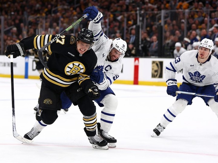  Bruins defenceman Hampus Lindholm battles with Leafs captain John Tavares as Matthew Knies looks on during Game 5 in Boston on Tuesday.  Maddie Meyer/Getty Images