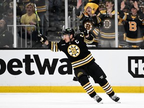 Brad Marchand of the Bruins reacts to a goal by teammate Jake DeBrusk (not in photo) against the Maple Leafs during Game One of their playoff series at TD Garden in Boston Saturday night. Brian Fluharty/Getty Images