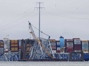 Salvage work continues on the collapsed Francis Scott Key Bridge, Tuesday, April 2, 2024, in Baltimore.