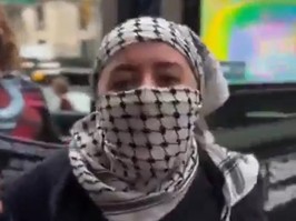 An unidentified masked protester was caught on video declaring her support for Hamas at a Gaza Solidarity Encampment rally near Columbia University in New York City on Wednesday, April 17, 2024.