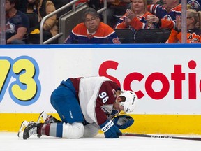 Mikko Rantanen of the Colorado Avalanche reacts after being hit by Mattias Ekholm (not pictured) of the Edmonton Oilers during the second period at Rogers Place on April 5, 2024 in Edmonton.