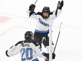 Toronto's Sarah Nurse (20) celebrates with teammate Emma Maltais (27) after scoring against Montreal in overtime during PWHL action at the Bell Centre in Montreal, Saturday, April 20, 2024.