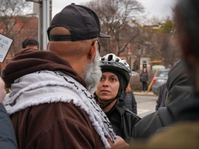 Police officer looks at a protester