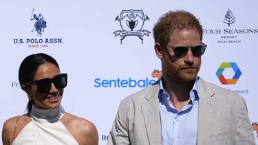 Prince Harry, right, and wife Meghan Markle, Duchess of Sussex, arrive for the 2024 Royal Salute Polo Challenge to Benefit Sentebale, Friday, April 12, 2024, in Wellington, Fla.
