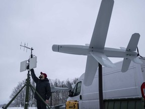An engineer assembles an antenna for guiding an exploding drone in Kyiv region, Ukraine, on Saturday, Feb. 10, 2024.