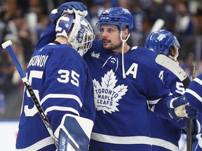 Maple Leafs forward Auston Matthews congratulates teammate Ilya Samsonov on a victory against the Panthers at Scotiabank Arena in Toronto, Monday, April 1, 2024.