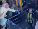 A soccer fan hits Abderrazak Hamdallah with a whip in this screenshot from video posted to X.