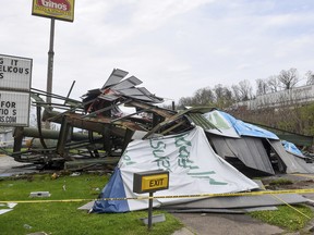 A steel billboard and its support were blown over