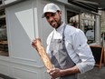Baker Xavier Netry poses at his bakery named Utopie in Paris on April 26, 2024, after being awarded best baguette 2024 of the city of Paris (Grand Prix de la Baguette de Tradition Francaise de la Ville De Paris).