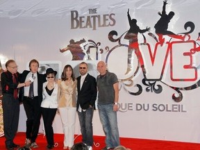 From left, Larry King, Paul McCartney, Yoko Ono Lennon, Olivia Harrison, Ringo Starr and Guy Laliberte, founder of Cirque du Soleil, pose for photos during the first anniversary of the Beatles Love at the Mirage hotel-casino in Las Vegas, June 26, 2007.