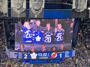The family of Rodion Amirov looks on during an in-game tribute during Thursday night's Maple Leafs-Devils game in Toronto.