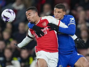 Arsenal's Gabriel Jesus, left, duels for the ball with Chelsea's Thiago Silva during the English Premier League soccer match between Arsenal and Chelsea at Emirates Stadium in London, Tuesday, April 23, 2024.