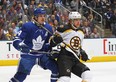 Maple Leafs' Auston Matthews (left) and Bruins' David Pastrnak mix it up at Scotiabank Arena on Oct. 19, 2019 in Toronto.