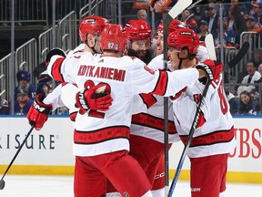 The Carolina Hurricanes celebrate a first period goal by Brent Burns #8 of the Carolina Hurricanes (centre) in Game Three of the First Round of the 2024 Stanley Cup Playoffs at UBS Arena on April 25, 2024 in Elmont, N.Y.