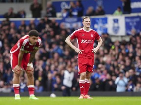 Nottingham Forest's Chris Wood and Nottingham Forest's Morgan Gibbs-White, left, show dejection during the English Premier League soccer match between Everton and Nottingham Forest at Goodison Park, Liverpool, England, Sunday April 21, 2024.