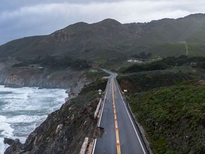 After days of heavy rainfall, hail and powerful winds over the last 24 hours a portion of U.S. Highway 1 collapsed into the Pacific Ocean, trapping visitors and residents in Big Sur, Calif., on Saturday.