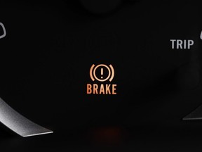 A brake light signal on the car panel.