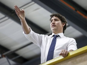 Prime Minister Justin Trudeau tours a modular home construction facility before making a housing announcement in Calgary, Alta., Friday, April 5, 2024.
