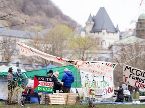 Pro-Palestinian activists are seen in their encampment set up on McGill University's campus in Montreal, Monday, April 29, 2024. The university says it will make efforts to de-escalate before asking for police help with a camp that's been set up on campus by pro-Palestinian activists.