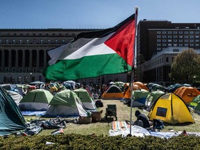 Columbia University students participate in an ongoing pro-Palestinian encampment on their campus following last week's arrest of more than 100 protesters on April 25, 2024 in New York City.