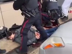 Video of the blood-soaked scene was posted on social media after a Toronto cop was stabbed and the suspect was shot by police out front of a Tim Hortons near College St. and Lansdowne Ave. on Friday, April 12, 2024.