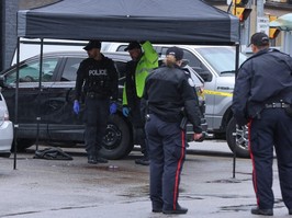 Toronto Police investigate after a cop was stabbed and the suspect was shot by police out front of a Tim Hortons near College St. and Lansdowne Ave. on Friday, April 12, 2024.