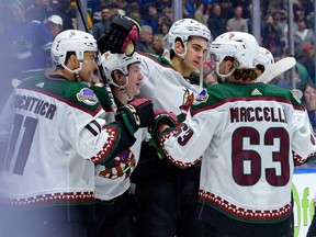 Logan Cooley #92 of the Arizona Coyotes is congratulated after scoring a goal in overtime against the Vancouver Canucks during their NHL game at Rogers Arena on April 10, 2024 in Vancouver.