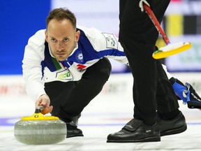 Italy's Joel Retornaz drew the four-foot ring in an extra end for a 7-6 victory over Canada's Brad Gushue on Monday at the world men's curling championship. Retornaz throws while taking on Canada at the Men's World Curling Championship in Ottawa on Saturday, April 1, 2023.