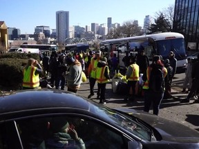 Screenshot of migrants arriving on buses in Denver, Colorado.