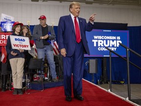 Republican presidential candidate former President Donald Trump takes the stage before speaking Tuesday, April 2, 2024, at a rally in Green Bay, Wis.