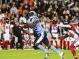 Toronto Argonauts wide receiver DaVaris Daniels (80) catches a pass as Ottawa Redblacks linebacker Frankie Griffin (28) defends during fCFL action in Toronto, Saturday, Oct. 14, 2023.