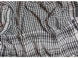 The Palestinian keffiyeh is a gender-neutral checkered black and white scarf that is usually worn around the neck or head.
