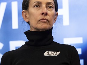 Rachel Goldberg, a mother of American hostage Hersh Goldberg-Polin, is seen wearing a sticker writing a number 182, during a press conference by families of American hostages in Gaza and elected officials, Friday, April. 5, 2024, in New York.
