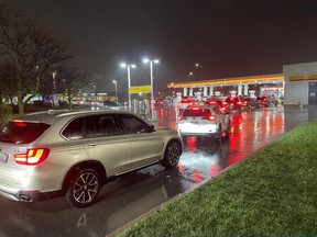 Drivers line up for gas before an expected double-digit price hike on Wednesday, April 17, 2024.