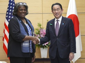 US Ambassador to the UN Linda Thomas-Greenfield (L) and Japan's Prime Minister Fumio Kishida shake hands during a meeting at the prime minister's office in Tokyo on April 19, 2024.