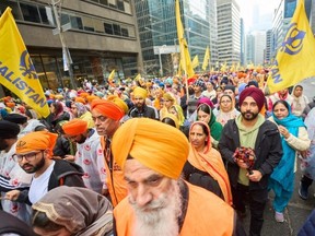 Thousands endured the rain to mark the Sikh New Year Sunday by taking part in Khalsa Day celebrations in downtown Toronto.