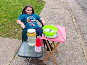 Emouree Johnson, 7, started selling lemonade for $1 per glass in Scottsboro, Ala., to raise money for a headstone for her mother, who died in March.