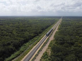 The inaugural train travels on the Maya Train rail route
