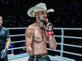 BANGKOK – Calgary's Jake Peacock celebrates his One Championship debut win over Japanese bantamweight Kohei (Samurai Warrior) Shinjo, not shown, in a Muay Thai bout in Bangkok in a Friday, April 5, 2024, handout photo. The 30-year-old Peacock, who was born without a right hand, improved to 13-1.