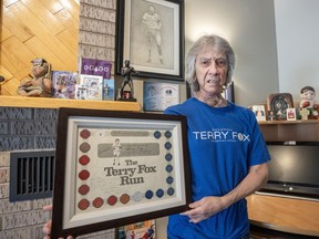 Eddy Nolan, who has run in a Terry Fox marathon each year for 46 years, is seen with some of his memorabilia, in Montreal, Tuesday, April 9, 2024.