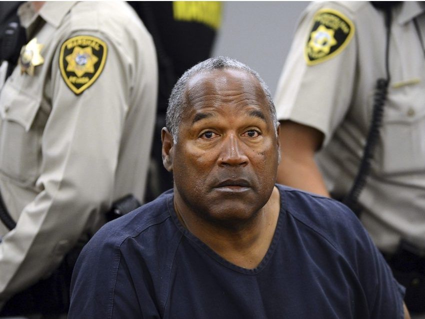 In this May 14, 2013, file photo, O.J. Simpson sits during a break on the second day of an evidentiary hearing in Clark County District Court in Las Vegas. Simpson, the decorated football superstar and Hollywood actor who was acquitted of charges he killed his former wife and her friend but later found liable in a separate civil trial, has died. He was 76.