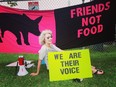 Animal advocates are celebrating after parts of a controversial Ontario agricultural law that made it illegal to lie to get a job on a farm in order to expose conditions inside were deemed unconstitutional.Regan Russell protests outside Fearmans Pork in Burlington, Ont., in an undated handout photo.THE CANADIAN PRESS/HO - Regan Russell Family **MANDATORY CREDIT**