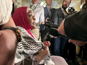Independent Member of Provincial Parliament Sarah Jama speaks with members of the press at Queen's Park while she wears a keffiyeh, a traditional utilitarian scarf worn across the Arabic-speaking world which also holds political significance for Palestinian people, in Toronto, Thursday, April 25, 2024.
