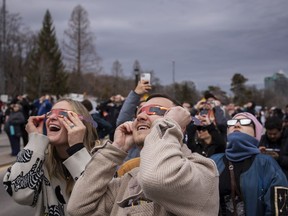 If you're wondering whether there is a Guinness World Record for "largest gathering of people dressed as the sun", the answer is, yes, and it now belongs to Niagara Falls, Ont. People watch the total solar eclipse in Niagara Falls, Ont., on Monday, April 8, 2024.
