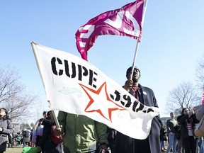 Academic workers from York University walk a picket line on the school's campus in Toronto on Monday, Feb 26, 2024.