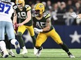 FILE- Green Bay Packers linebacker Eric Wilson (45) rushes during the first half against the Dallas Cowboys of an NFL wild-card playoff football game Sunday, Jan. 14, 2024 in Arlington, Texas. The Bay Packers have boosted their special teams by re-signing linebacker Eric Wilson.