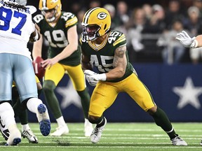 FILE- Green Bay Packers linebacker Eric Wilson (45) rushes during the first half against the Dallas Cowboys of an NFL wild-card playoff football game Sunday, Jan. 14, 2024 in Arlington, Texas. The Bay Packers have boosted their special teams by re-signing linebacker Eric Wilson.