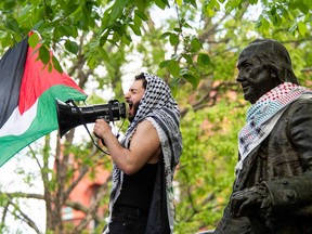 Pro-Palestinian students of Drexel University and the University of Pennsylvania demonstrate as they march from the City Hall to the University of Pennsylvania campus in Philadelphia on April 25, 2024.