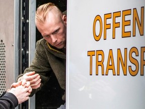 Jonathan Handel, 37, steps out of an OPP offender transport van in handcuffs at the courthouse in Peterborough, Ont., on Thursday April 4, 2024.